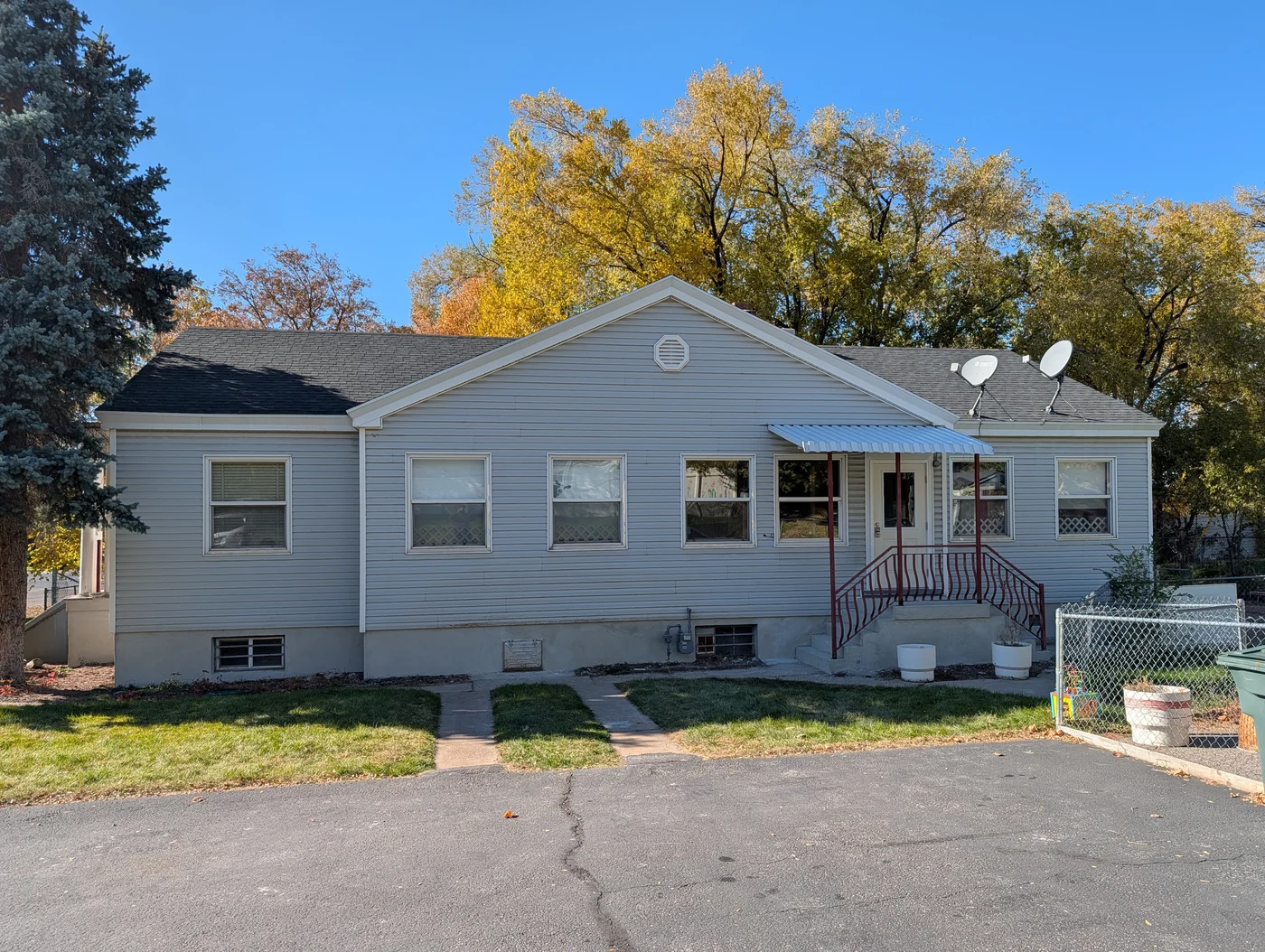 Paved parent drop-off and pickup parking area leading directly to the covered entrance porch